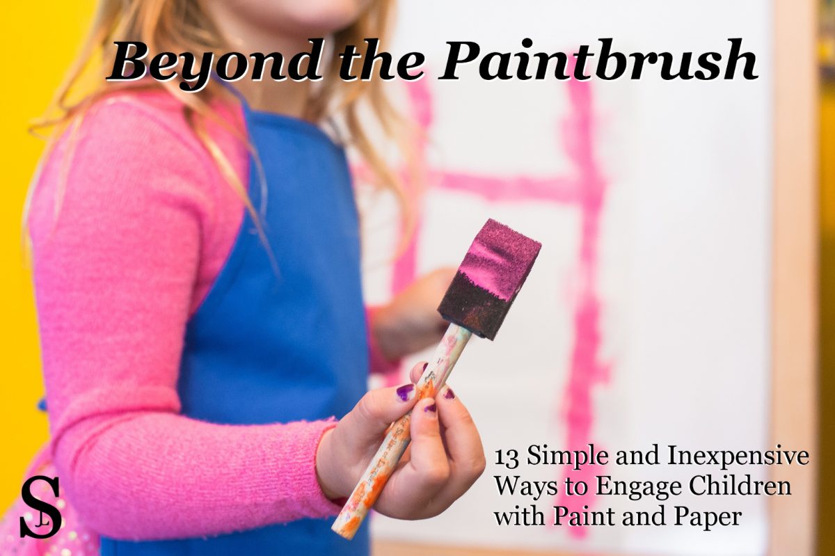 Girl holding paintbrush