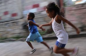 Two children running fast