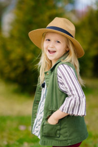 Girl with hat smiling