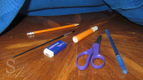 Various office supplies under cloth