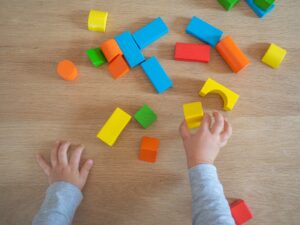 Child playing with wooden blocks