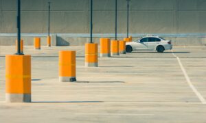 Car parked in empty parking lot