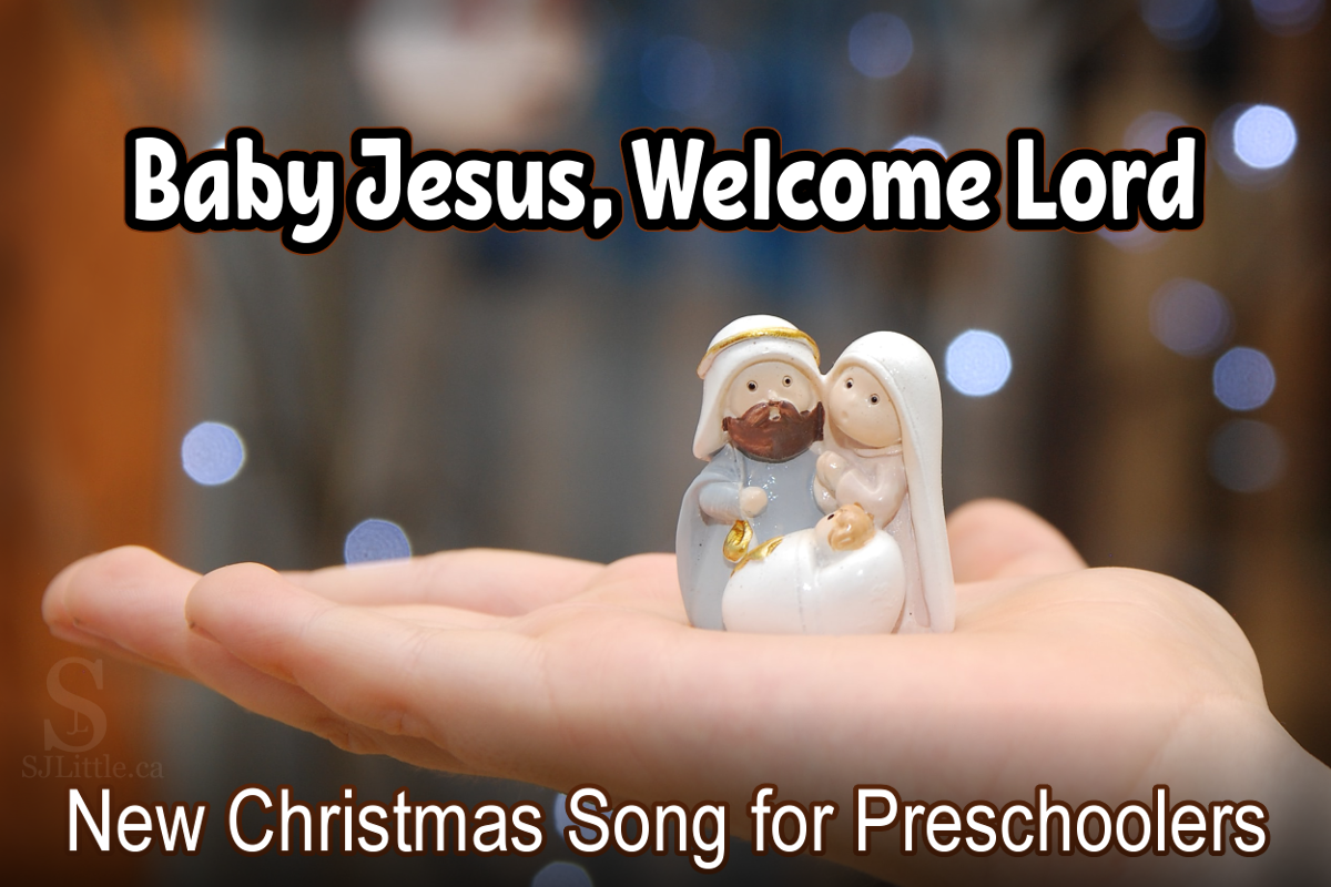 Hand holding nativity scene picturing Jesus, Mary, and Joseph