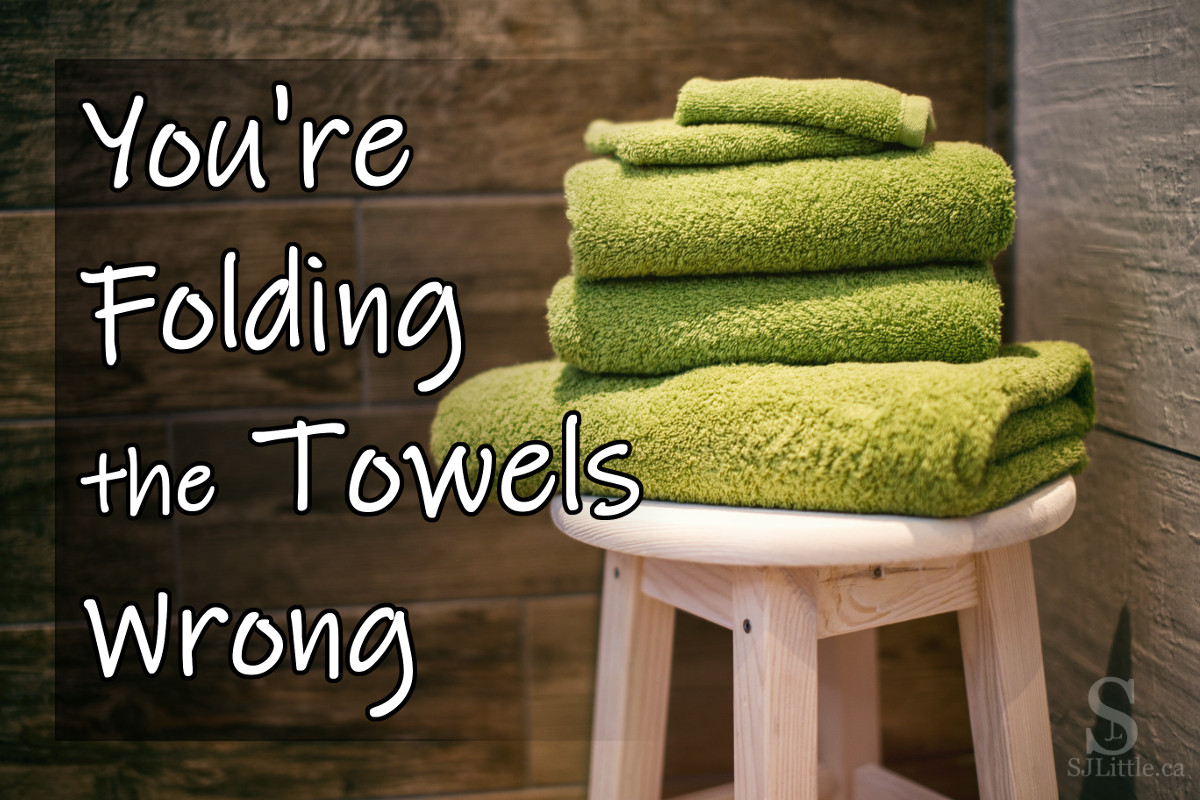 A pile of folded green towels behind the title "You're Folding the Towels Wrong"